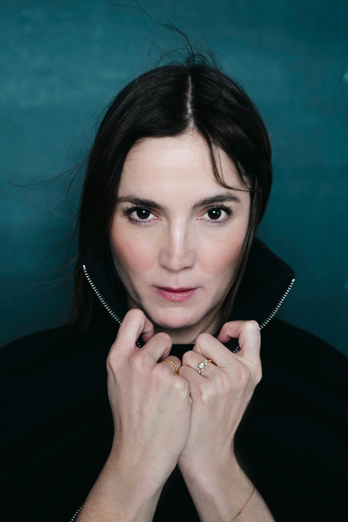 Portrait of Markéta Stehlíková, teal backdrop